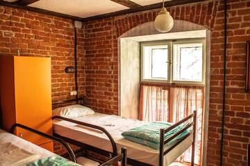 Односпальная кровать в общем номере для женщин в  Lviv Loft Hostel
